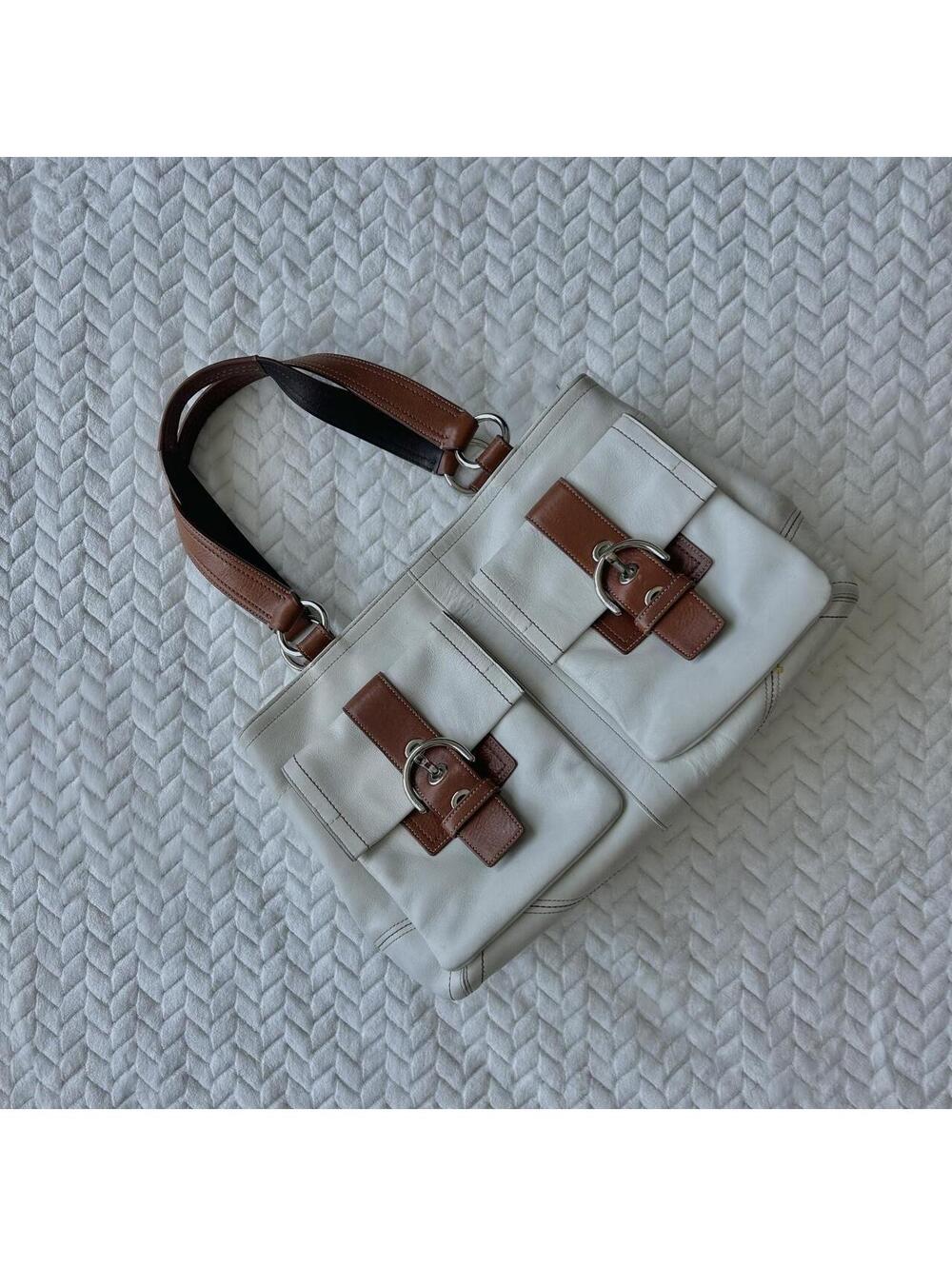 Cream leather handbag with brown leather accents and silver hardware #handbag